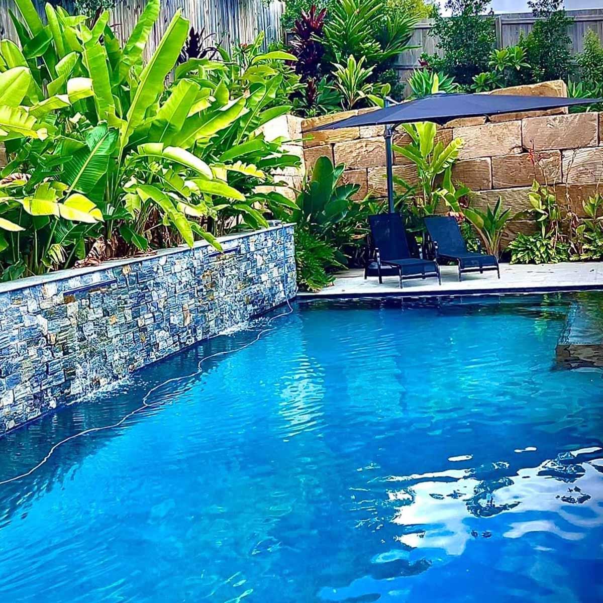 pool with retaining wall and plants